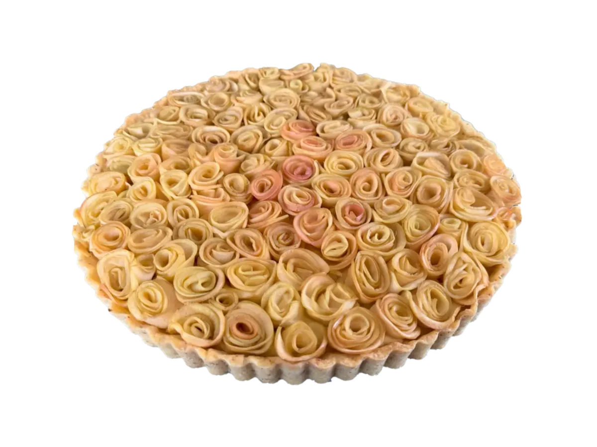 Apple rose tart with densely arranged apple roses made from thin apple slices in a round tart pan.
