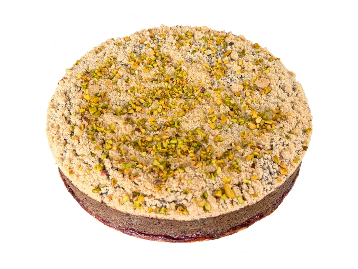 Poppy seed cake with cherries and streusel topped with pistachios