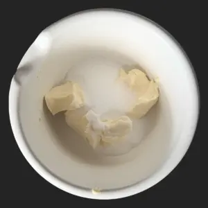 Margarine and sugar in mixing bowl